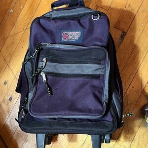 Olympia Sports Plus rolling backpack